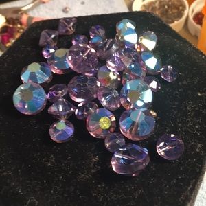 Various shapes and sizes of purple colored beads